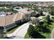 Aerial view of community clubhouse with pool and palm trees at 9234 Sommerset Hills Dr, Davenport, FL 33896