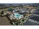 Resort-style pool, water park, and clubhouse with a putting green at 9234 Sommerset Hills Dr, Davenport, FL 33896