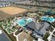 Aerial view of community pool, clubhouse, and putting green at 9234 Sommerset Hills Dr, Davenport, FL 33896