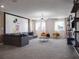 Spacious game room with Mickey Mouse wall art and comfy seating at 9234 Sommerset Hills Dr, Davenport, FL 33896