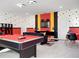 Fun game room with pool table, Mickey Mouse decor, and seating area at 9234 Sommerset Hills Dr, Davenport, FL 33896