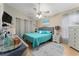Main bedroom with a teal comforter and large TV at 2507 Talega Dr, St Cloud, FL 34772