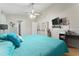 Main bedroom with teal bedding and built-in dresser at 2507 Talega Dr, St Cloud, FL 34772