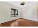 Well lit bedroom with hardwood floors and a ceiling fan at 1009 Wiregrass St, Celebration, FL 34747