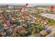 Aerial view of community, pool, and location near major roads at 12209 Wild Iris Way # 110, Orlando, FL 32837