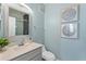 Small bathroom with gray vanity and a toilet at 12209 Wild Iris Way # 110, Orlando, FL 32837