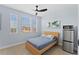 Bright bedroom with light walls and wood flooring at 12209 Wild Iris Way # 110, Orlando, FL 32837