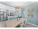 Elegant dining room with a chandelier and large windows at 12209 Wild Iris Way # 110, Orlando, FL 32837