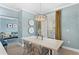 Bright dining room with chandelier and view into living room at 12209 Wild Iris Way # 110, Orlando, FL 32837