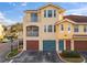 Exterior view of the building, showing the garage at 12209 Wild Iris Way # 110, Orlando, FL 32837