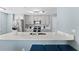Modern kitchen with stainless steel appliances and white quartz countertops at 12209 Wild Iris Way # 110, Orlando, FL 32837