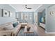 Living area with sectional sofa, hardwood floors, and TV at 12209 Wild Iris Way # 110, Orlando, FL 32837