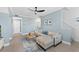 Open living area with sectional sofa and wood-look floors at 12209 Wild Iris Way # 110, Orlando, FL 32837