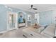 Open living room with sectional sofa and kitchen view at 12209 Wild Iris Way # 110, Orlando, FL 32837