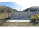 Backyard with a sand-based workout area and privacy fence at 1239 Berry Ln, Davenport, FL 33837