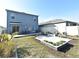 Large backyard with patio, multiple seating areas, and raised garden at 1239 Berry Ln, Davenport, FL 33837