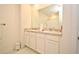 Double vanity bathroom with granite countertop and a shower at 1239 Berry Ln, Davenport, FL 33837