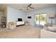 Bright Gathering room with sliding glass doors leading to the backyard at 1239 Berry Ln, Davenport, FL 33837