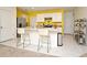 Modern kitchen with white cabinets and yellow wall at 1239 Berry Ln, Davenport, FL 33837