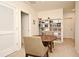 Small office space with a round table and built-in shelving at 1239 Berry Ln, Davenport, FL 33837