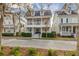 Inviting two-story home with a spacious double porch and well-manicured landscaping at 1241 Golden Canna Ln, Celebration, FL 34747