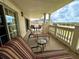 Relaxing balcony with outdoor lounge chairs, views of the community, and an outdoor table at 1350 Centre Court Ridge Dr # 401, Reunion, FL 34747