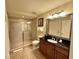 Bathroom featuring a glass-enclosed shower, toilet, and a vanity with granite countertops at 1350 Centre Court Ridge Dr # 401, Reunion, FL 34747