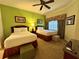 Bedroom offering two beds, comfortable seating, and views through a window at 1350 Centre Court Ridge Dr # 401, Reunion, FL 34747