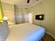 Bedroom featuring neutral carpet, a ceiling fan, and an entryway to the next room at 1350 Centre Court Ridge Dr # 401, Reunion, FL 34747