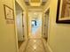 Hallway with tile flooring and multiple entryways to other rooms in the residence at 1350 Centre Court Ridge Dr # 401, Reunion, FL 34747