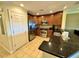 This kitchen features stainless steel appliances and dark wood cabinets that nicely complement the tile flooring at 1350 Centre Court Ridge Dr # 401, Reunion, FL 34747