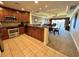 This kitchen features stainless steel appliances and dark wood cabinets that nicely complement the tile flooring at 1350 Centre Court Ridge Dr # 401, Reunion, FL 34747