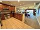 This kitchen features stainless steel appliances and dark wood cabinets that nicely complement the tile flooring at 1350 Centre Court Ridge Dr # 401, Reunion, FL 34747