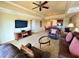 This living room features a ceiling fan, modern lighting, and an open floor plan at 1350 Centre Court Ridge Dr # 401, Reunion, FL 34747