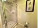 Shower with glass door and tile surround at 1350 Centre Court Ridge Dr # 401, Reunion, FL 34747