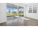 Bright and airy living area with large sliding glass doors offering scenic backyard and pond views at 1503 August Gray Dr, Kissimmee, FL 34744
