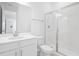 Modern bathroom featuring a glass-enclosed shower, and a sleek vanity sink at 1509 August Gray Dr, Kissimmee, FL 34744