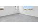 Empty room with tile flooring, and natural light from two large windows at 1509 August Gray Dr, Kissimmee, FL 34744