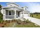 Beautiful two-story home featuring a well-manicured lawn and a two-car garage on a sunny day at 1509 August Gray Dr, Kissimmee, FL 34744