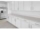Spacious kitchen featuring stainless steel appliances, quartz countertops, and a lot of storage at 1509 August Gray Dr, Kissimmee, FL 34744