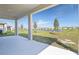 Covered patio with view to the lake and neighborhood at 1509 August Gray Dr, Kissimmee, FL 34744
