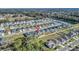 Aerial view of the home in its neighborhood showcases the layout of the community at 1944 Harvest Landing Cir, Lakeland, FL 33810