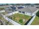 Aerial view of fenced backyard with lush lawn and landscaped perimeter at 1944 Harvest Landing Cir, Lakeland, FL 33810