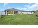 Backyard with spacious lawn and fenced perimeter at 1944 Harvest Landing Cir, Lakeland, FL 33810