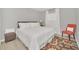 Cozy bedroom featuring a plush bed, stylish rug, and comfortable accent chair at 1944 Harvest Landing Cir, Lakeland, FL 33810