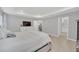 Light-filled main bedroom features wood-look floors and a gray color palette at 1944 Harvest Landing Cir, Lakeland, FL 33810