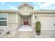 House exterior showcasing a welcoming front entry and landscaping at 1944 Harvest Landing Cir, Lakeland, FL 33810