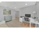 Bright home office with a large desk, neutral walls, and modern flooring at 1944 Harvest Landing Cir, Lakeland, FL 33810