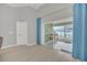 Living room slider opens up to a screened patio and a view of the backyard pond at 1944 Harvest Landing Cir, Lakeland, FL 33810