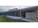 Rear exterior view showing screened porch and shed at 2201 Club Cir # 2201, Lake Wales, FL 33898